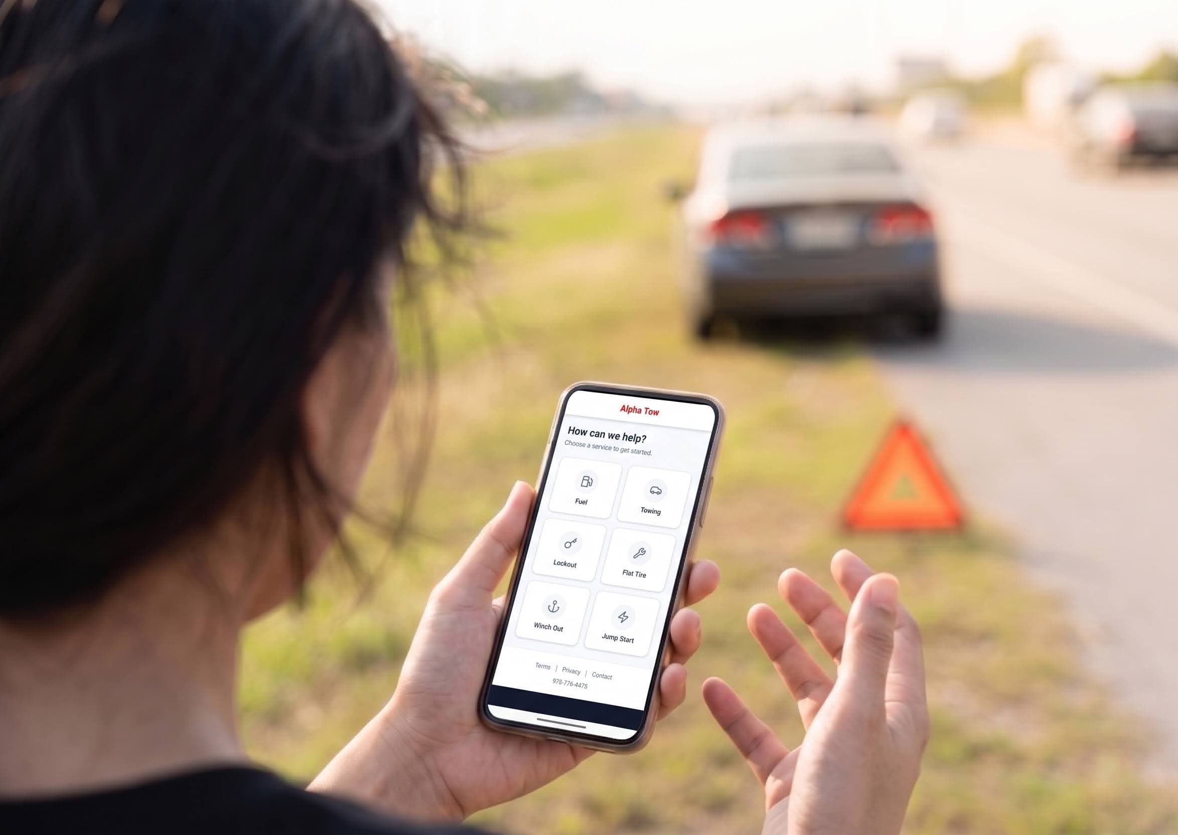 Stranded driver using a tow company's online booking page to request roadside assistance